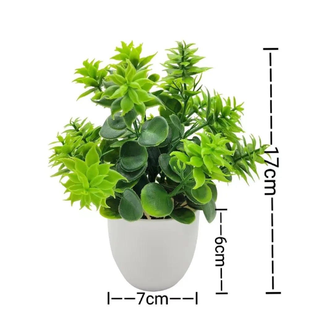 Small artificial potted plant with green foliage in a white pot, view 11