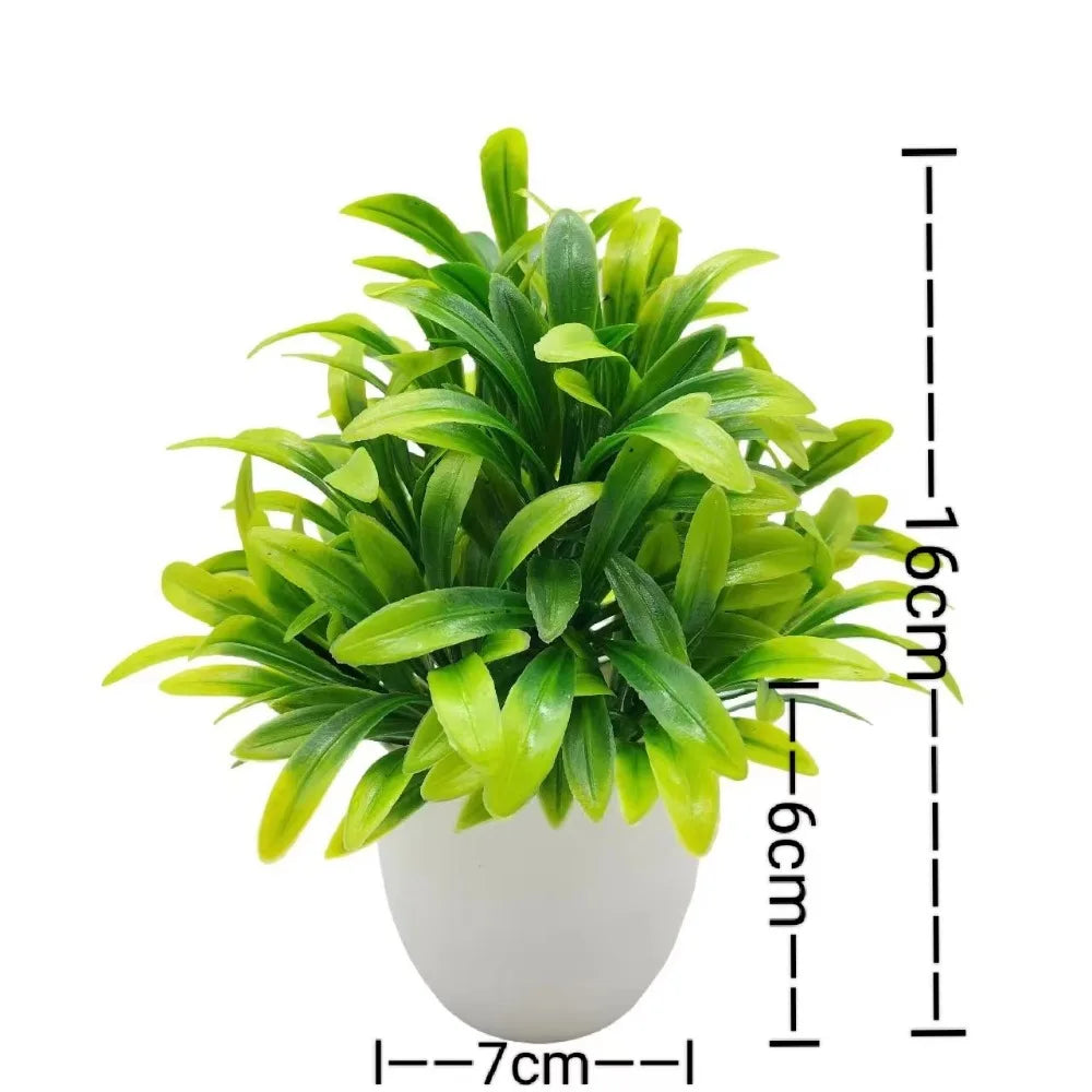 Small artificial potted plant with green foliage in a white pot, view 9