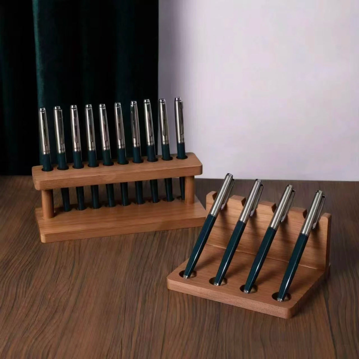 Walnut desk organiser with pen compartments and a phone slot
