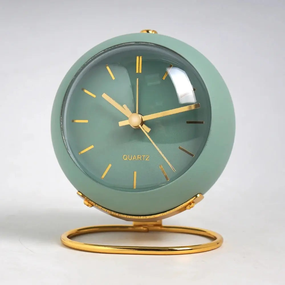 Small metal desk alarm clock with luminous hands