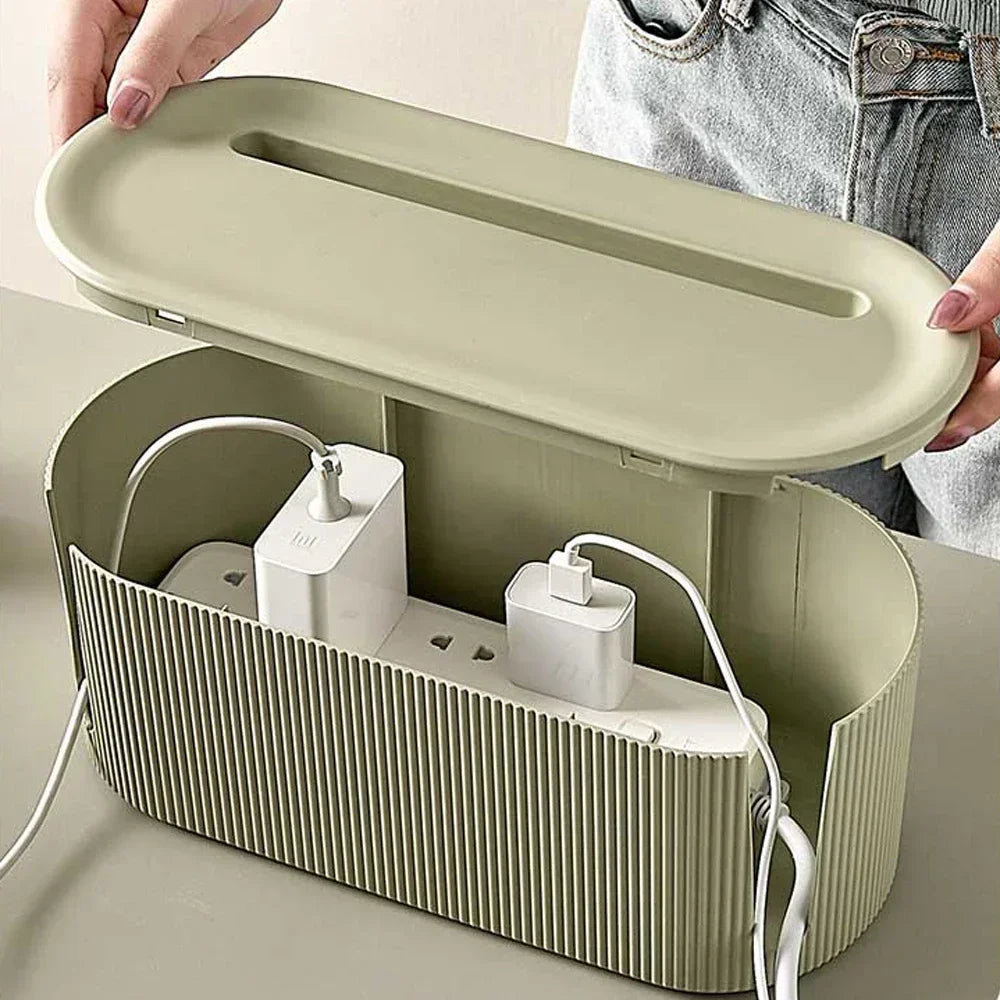 Green plug socket storage box on a sideboard