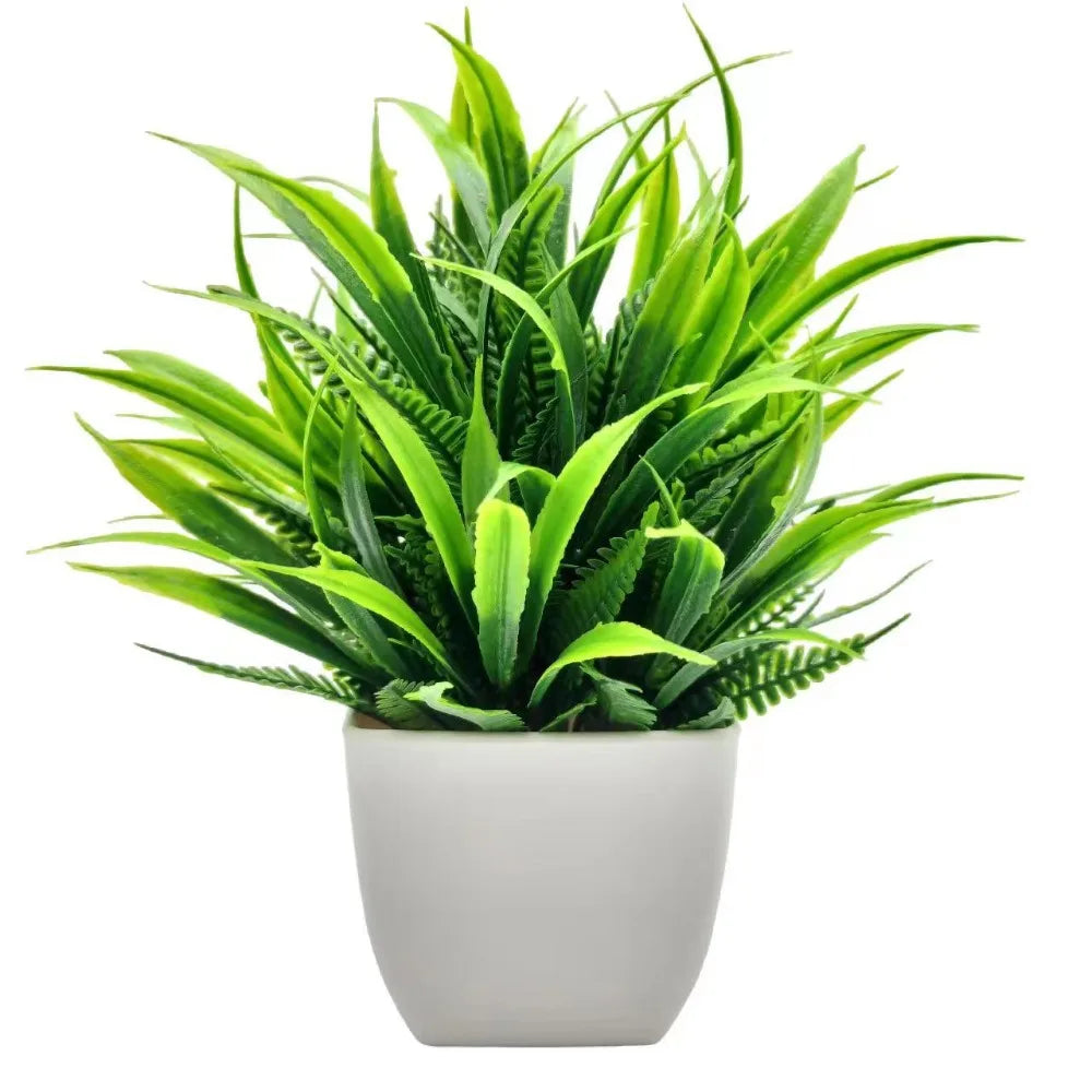 Small artificial potted plant with green foliage in a white pot, view 4