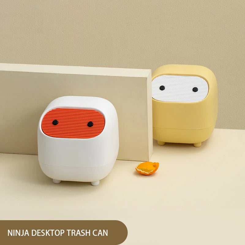 Yellow push lid waste basket on a desk