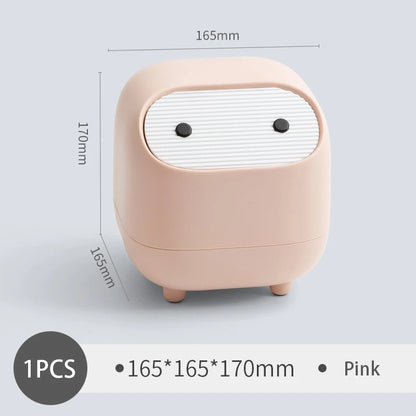 Mini bin held in a hand to show its size