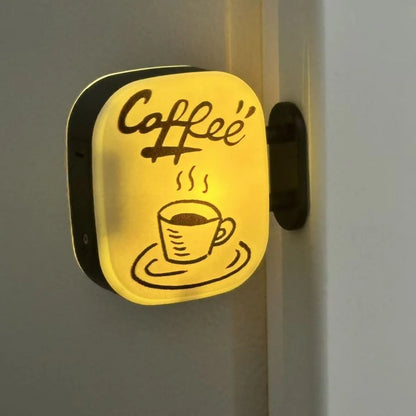 Coffee corner sign magnet held in a hand for scale