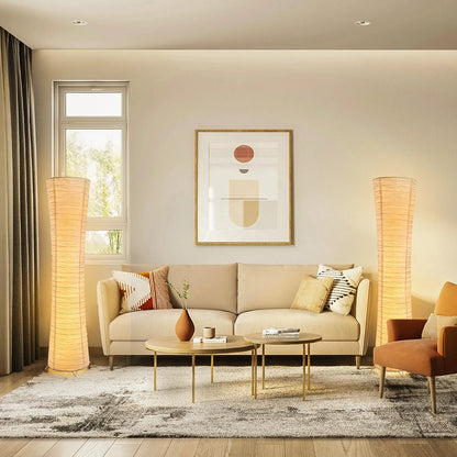 Modern living room with beige sofa, coffee table, and decorative elements.