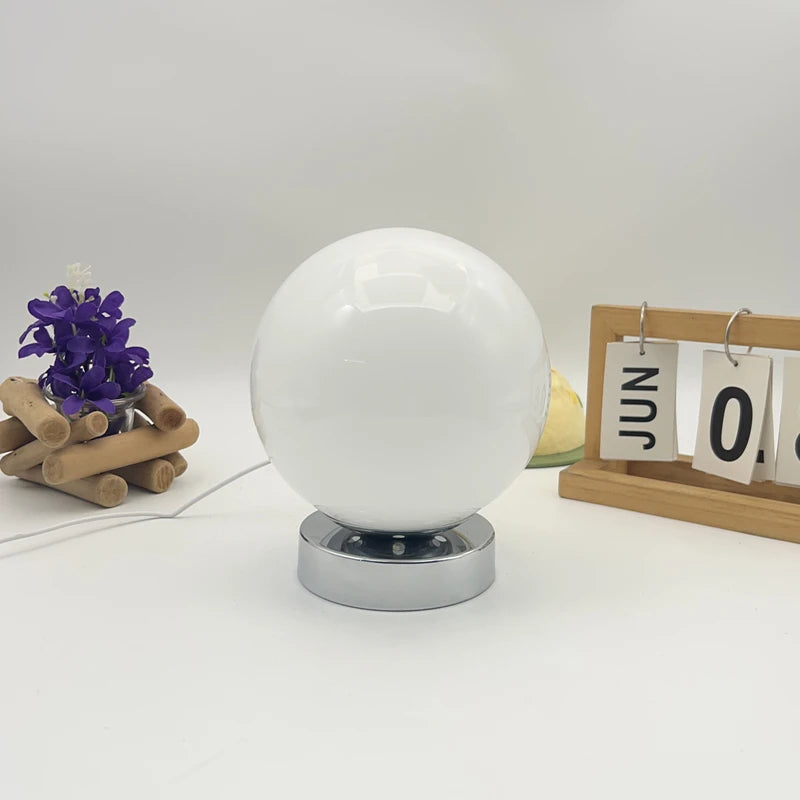 White round glass lamp switched off showing the glass finish