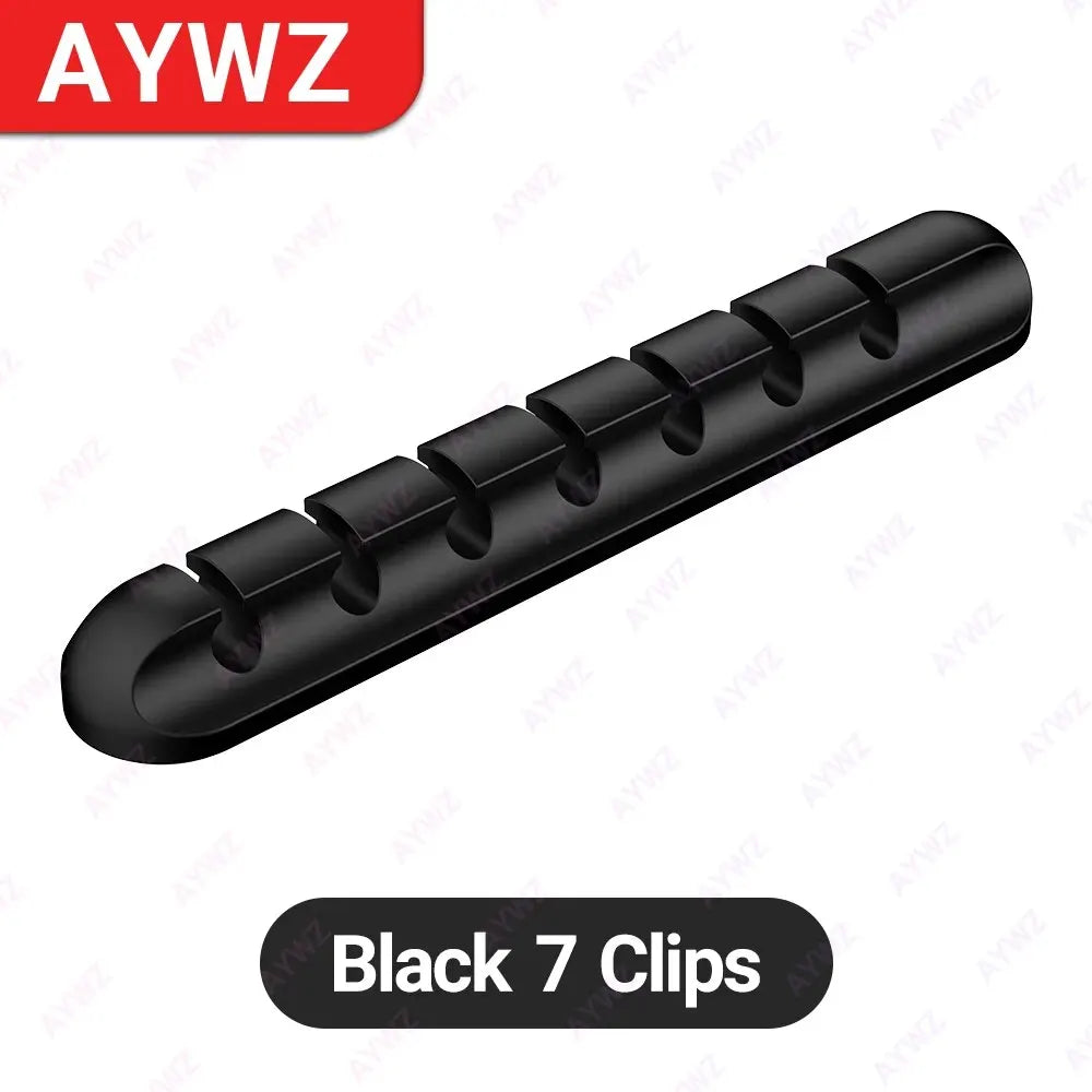 Cable clips mounted vertically on a desk leg