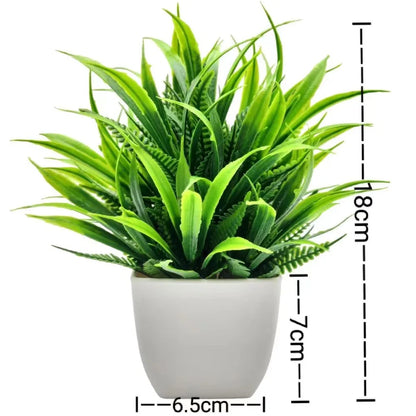 Small artificial potted plant with green foliage in a white pot, view 10