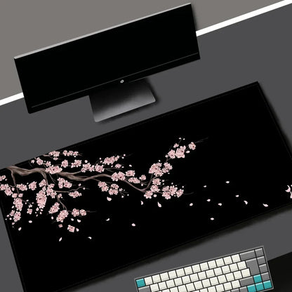 Black desk mat with a purple cherry blossom design, view 2
