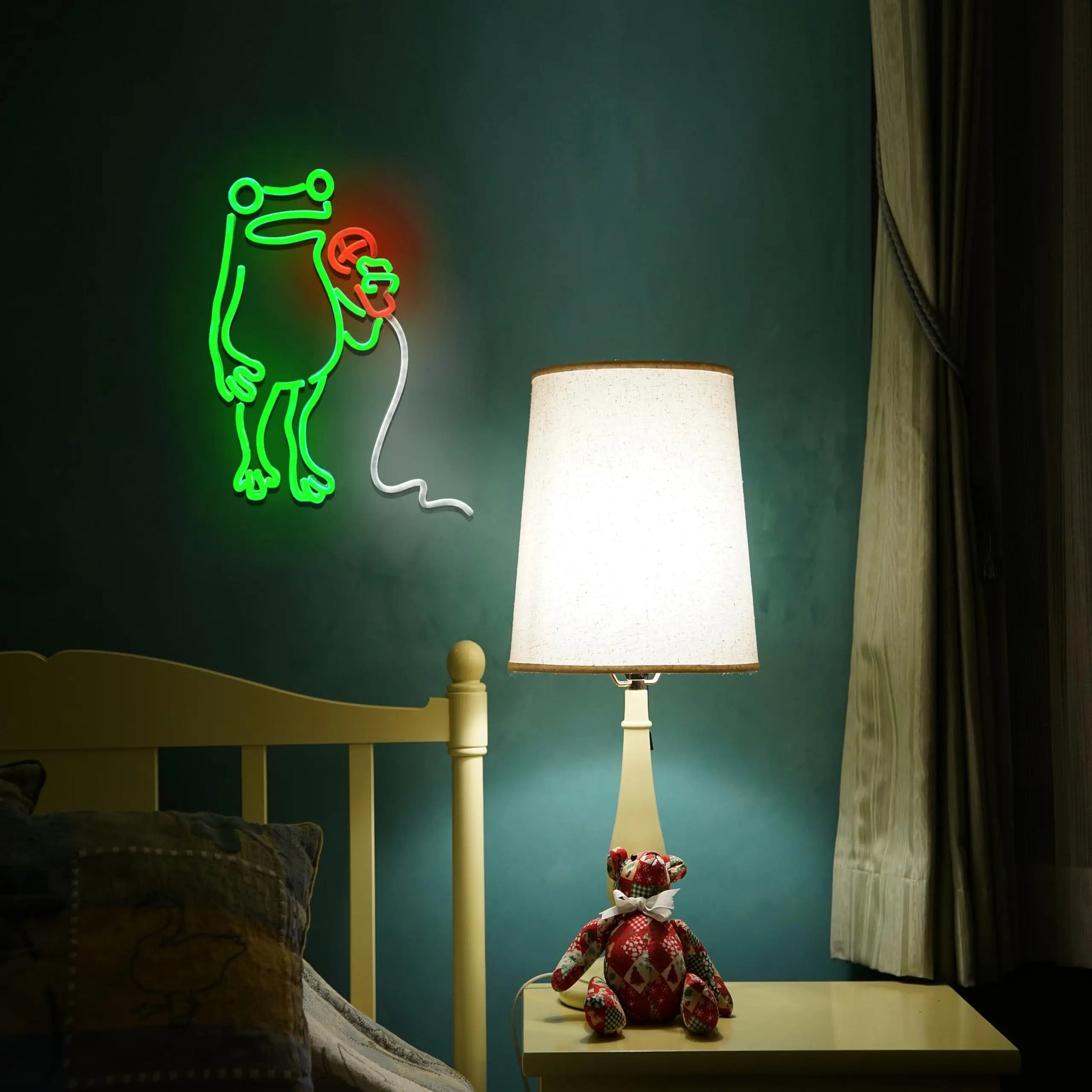 Neon sign of a dog with a bone, lamp, and teddy bear on a nightstand against a dark green wall.