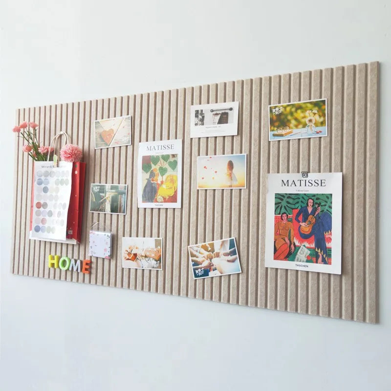 Felt vision board with pinned artwork and reminders