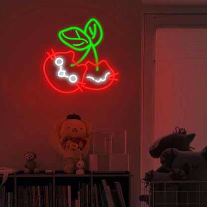 Neon sign of a cat with a flower on a wall with stuffed animals below.