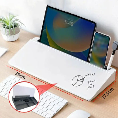 Glass desk whiteboard sitting between a keyboard and monitor