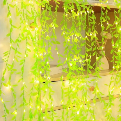Artificial leaf garland lights wrapped around shelf