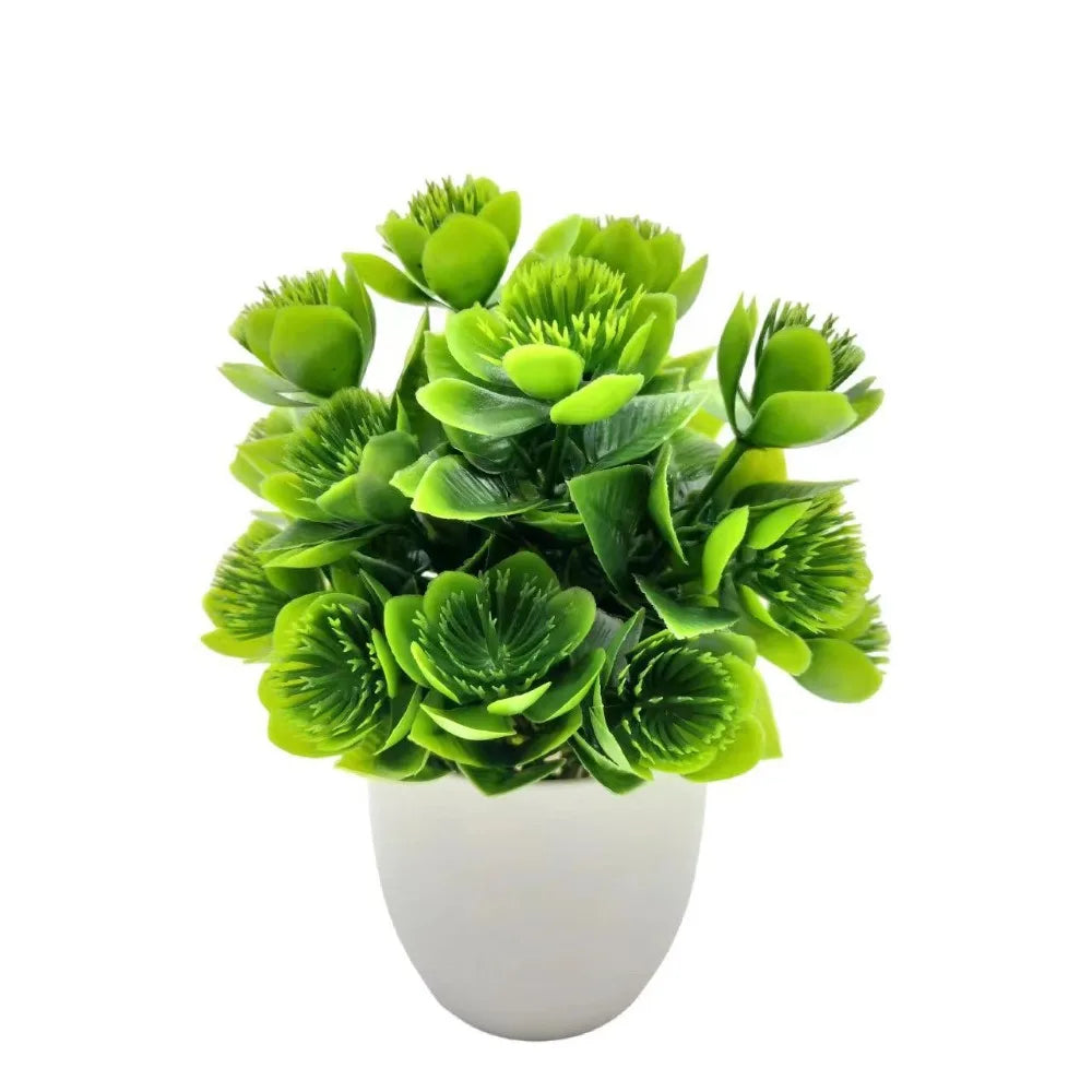 Small artificial potted plant with green foliage in a white pot, view 3