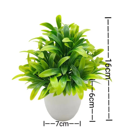 Small artificial potted plant with green foliage in a white pot, view 9