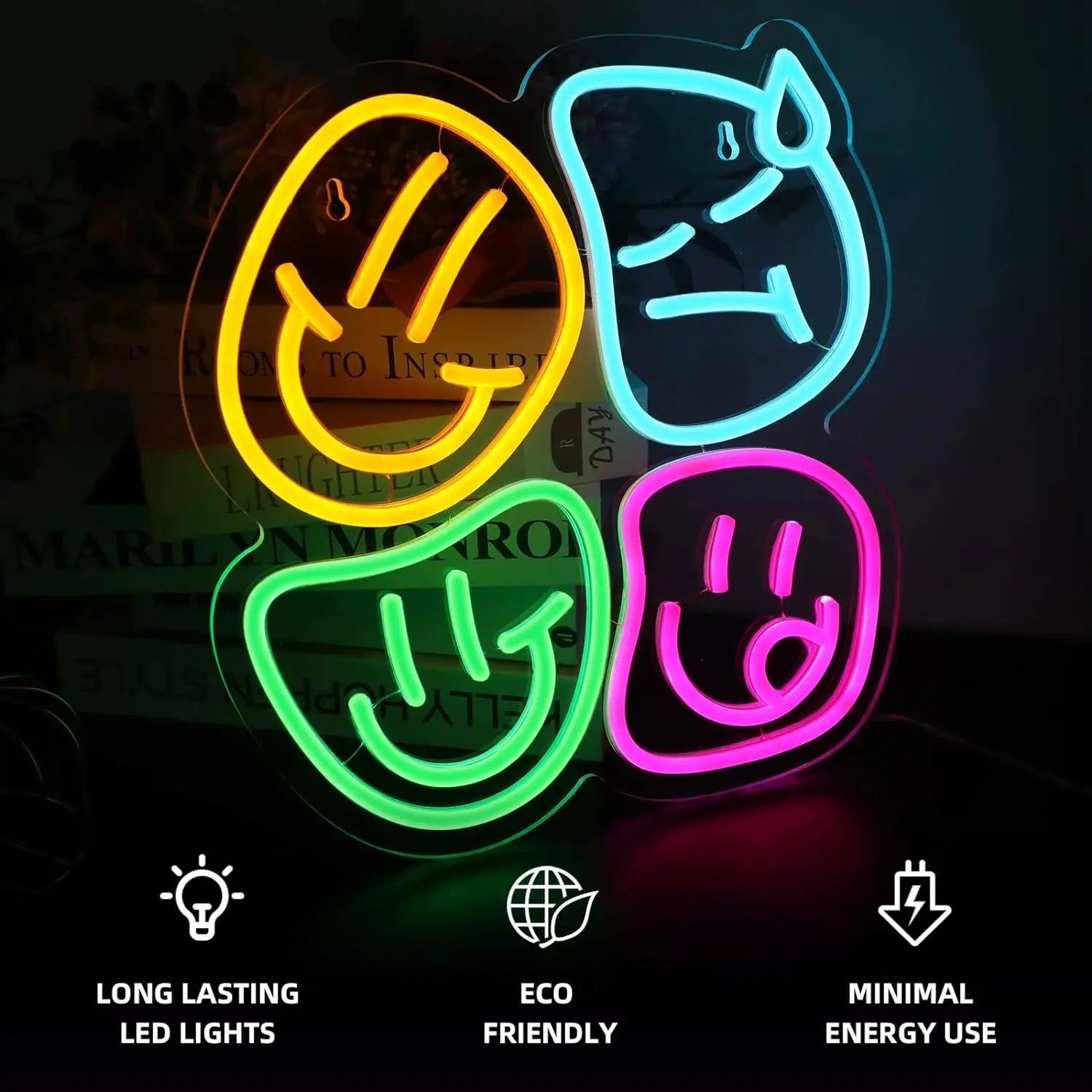 Neon signs in the shapes of a smiley face, peace sign, and heart with text indicating features on a dark background.