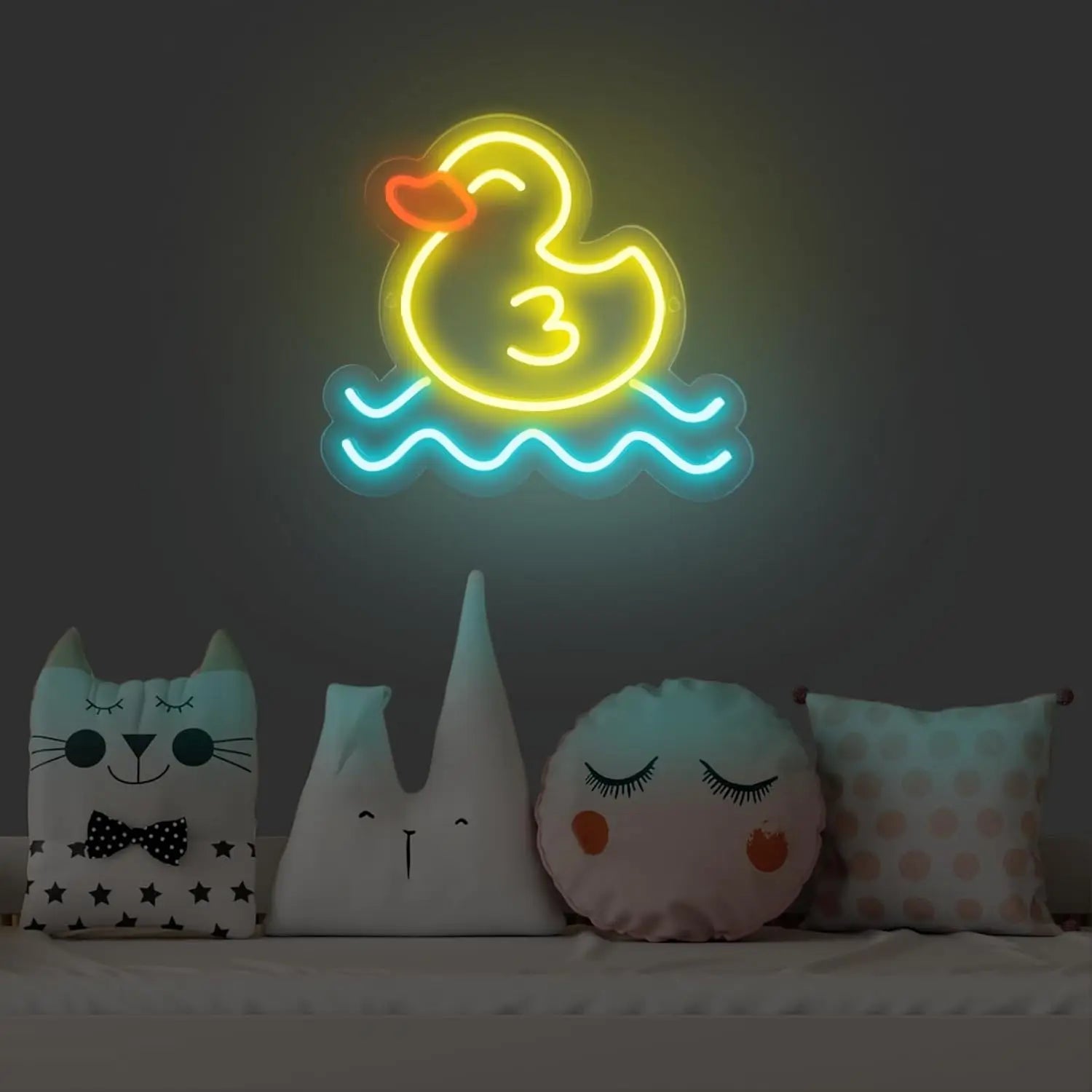 Neon sign of a duck with the number 3, surrounded by decorative pillows on a dark background