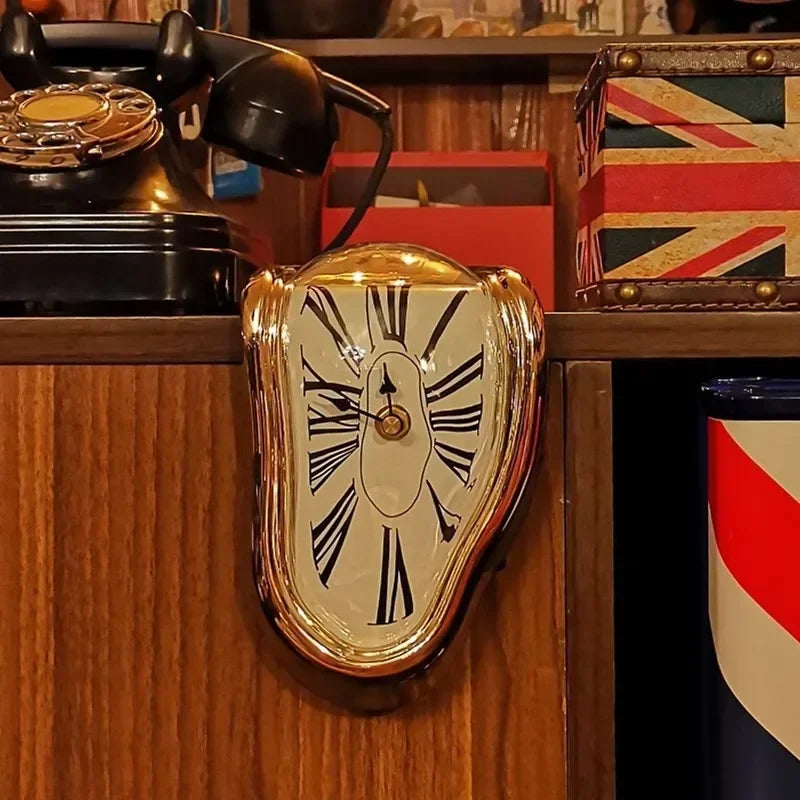 Melting wall clock draped over the edge of a shelf