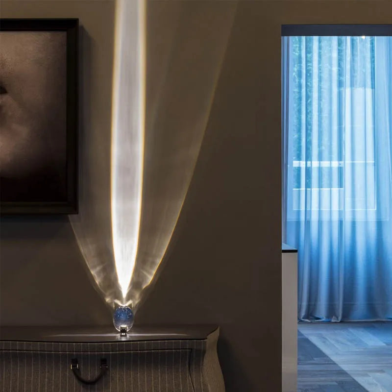 Egg shaped crystal lamp on bedside table