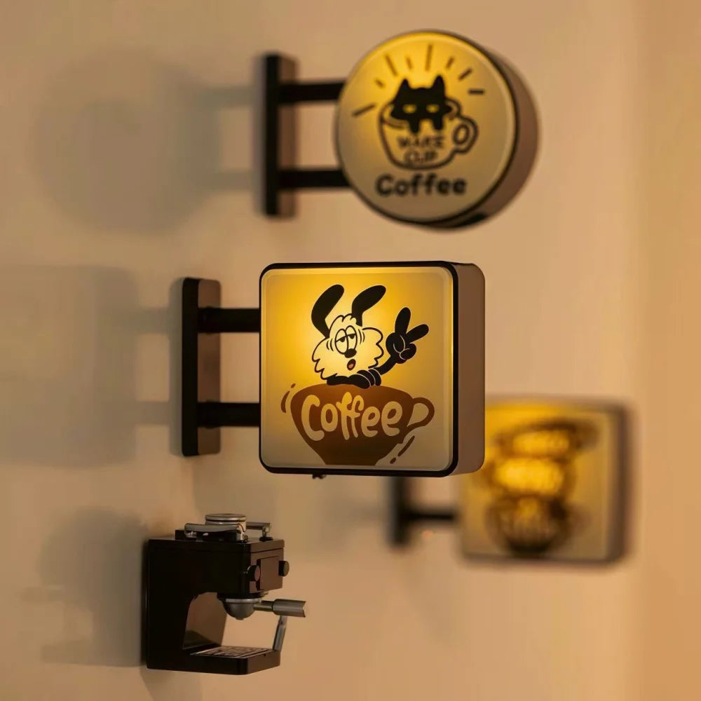 Several coffee sign magnets grouped on a fridge