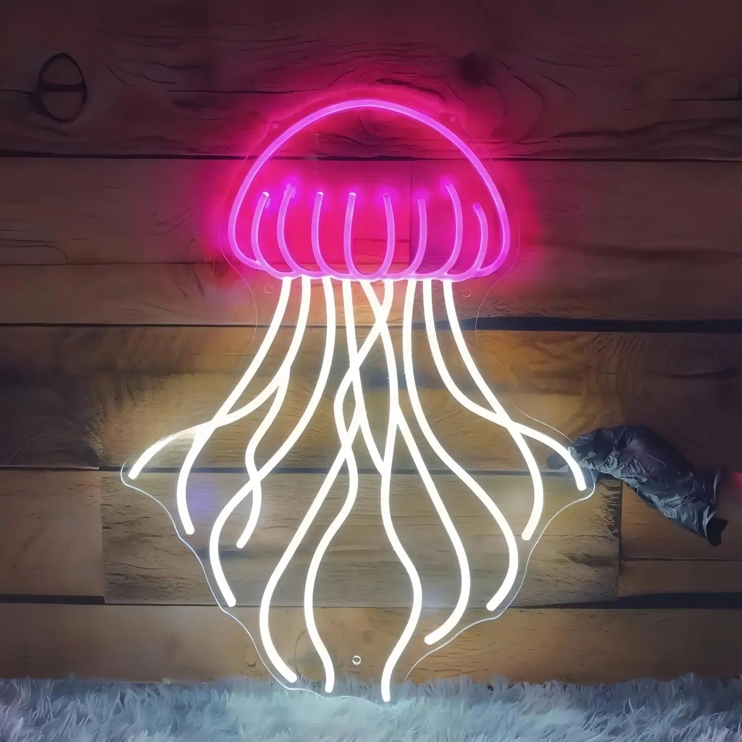 Neon jellyfish shape light on a wooden floor