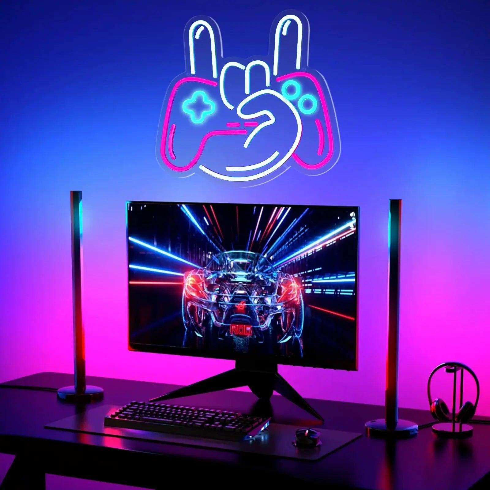 Gaming setup with monitor, keyboard, and neon sign above on a blue and pink gradient background