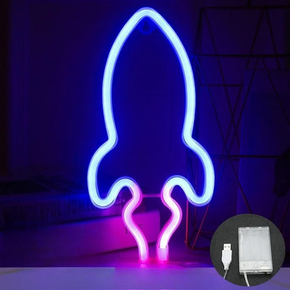 Neon light shaped like a rocket with a power adapter inset on a dark background