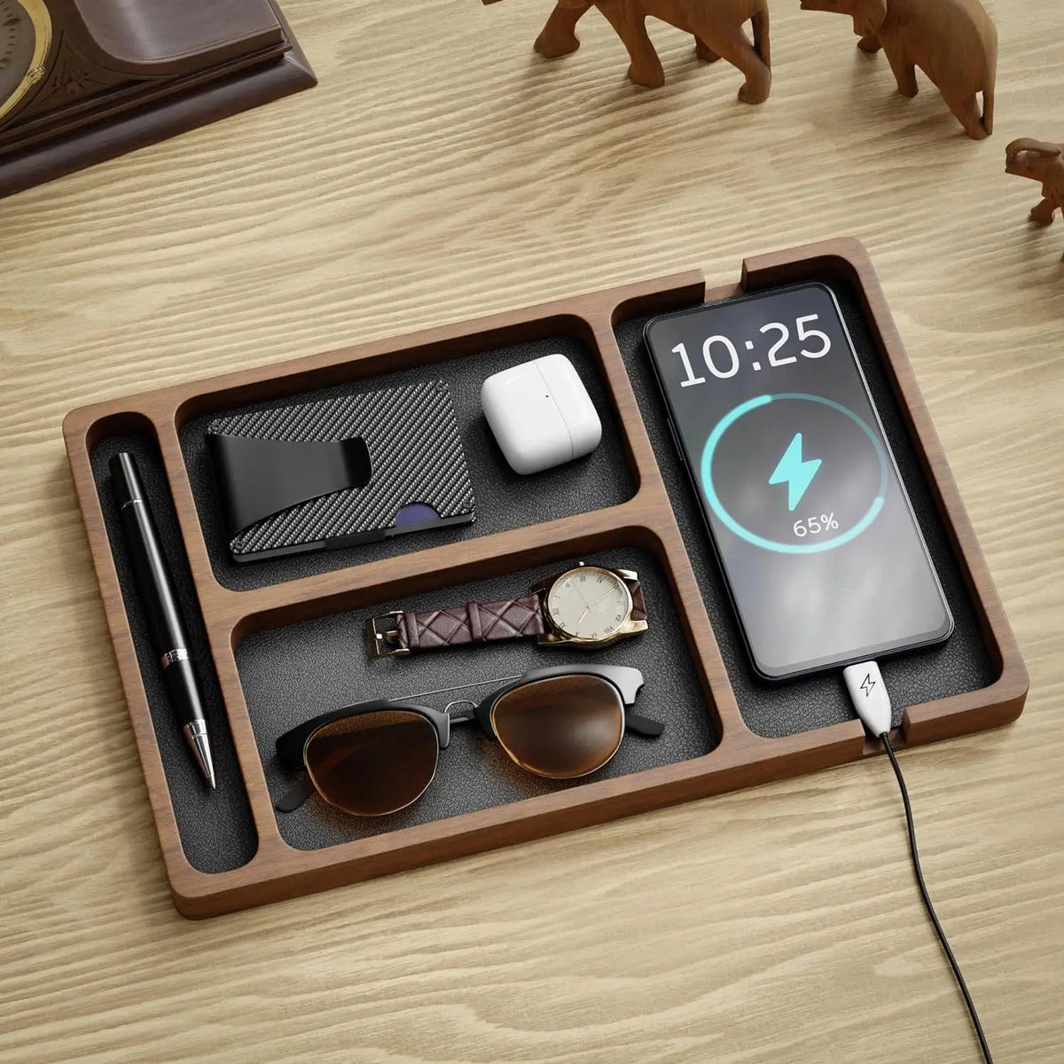 Solid wood desk organiser holding a phone and headphones