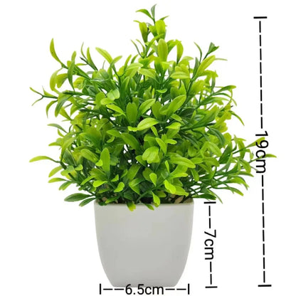 Small artificial potted plant with green foliage in a white pot, view 6