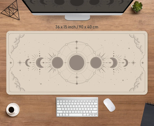 Beige desk mat printed with the phases of the moon