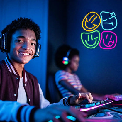 Person wearing headphones and interacting with a gaming console in a dark room with colorful smiley face symbols.