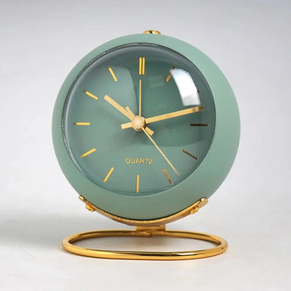 Small metal desk alarm clock with luminous hands