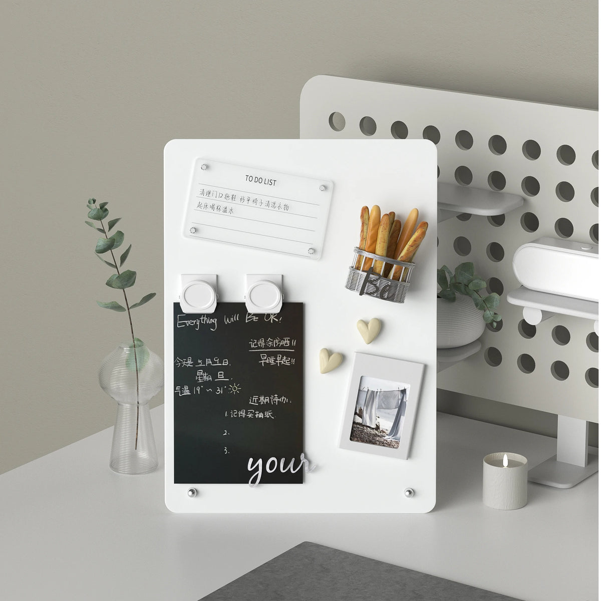 White magnetic message board with photos held by magnets