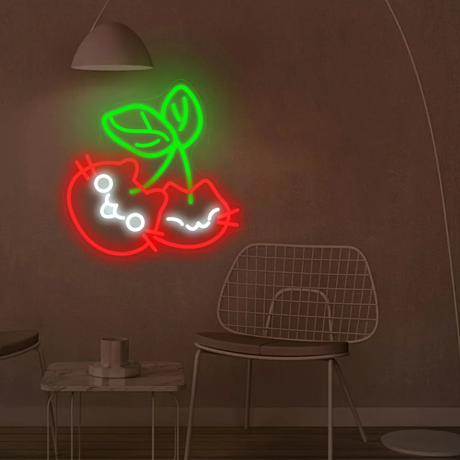 Neon sign of a cat and leaf on a brown wall with a chair and small table in the foreground.