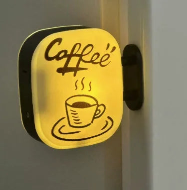 Fridge magnet sign shown against a plain background