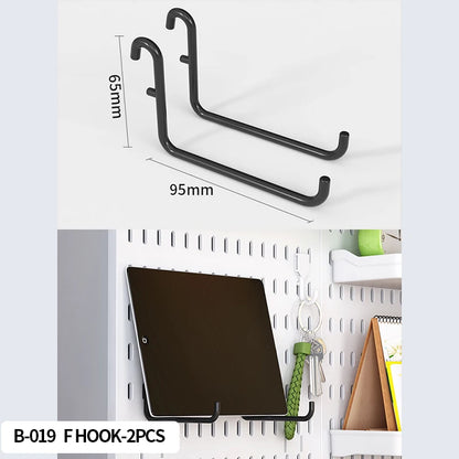 Pegboard cup holder holding pens and pencils