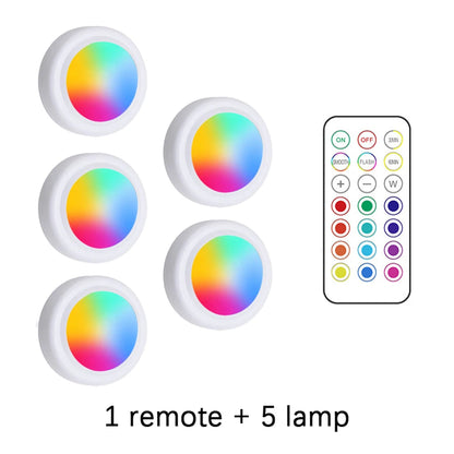 Set of five colorful LED lamps with a remote control on a white background