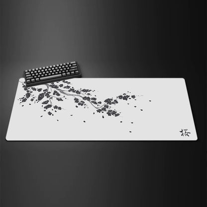 Black desk mat with a purple cherry blossom design, view 11