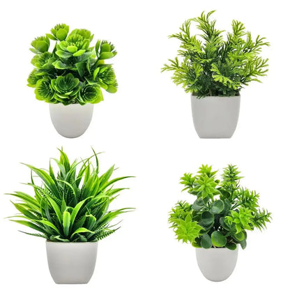 Small artificial potted plant with green foliage in a white pot