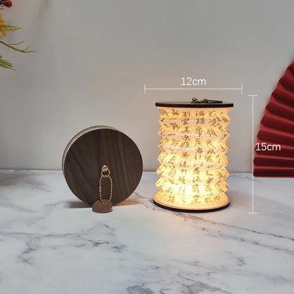 Folding lantern lamp on a windowsill at dusk