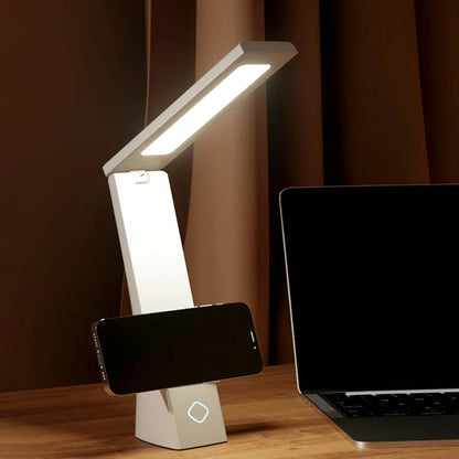 Folding LED lamp collapsed flat against its base