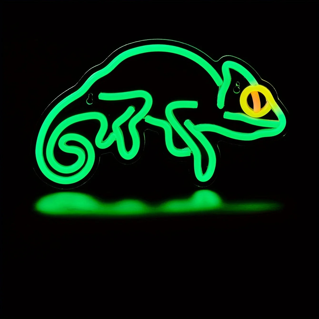 Neon sign of a chameleon on a black background