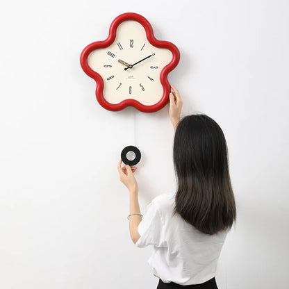 Pendulum clock version with the swing hanging below the dial
