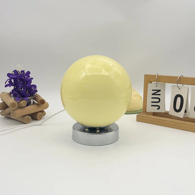 Glass table lamp dimmed low for evening mood lighting