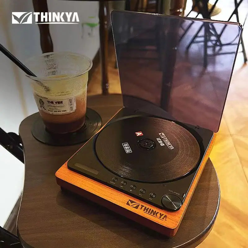 Wooden desktop CD player with a translucent dust cover, view 6