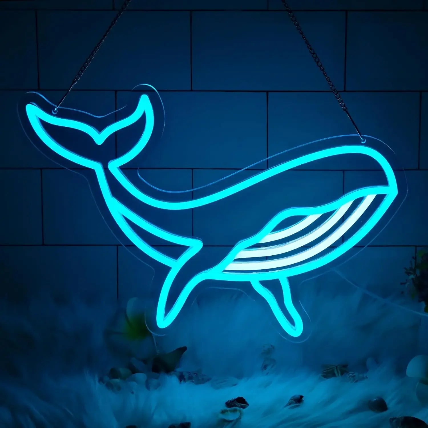 Neon whale shape sign on a dark background
