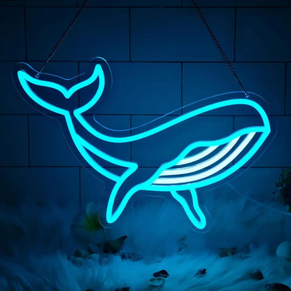 Neon whale shape sign on a dark background