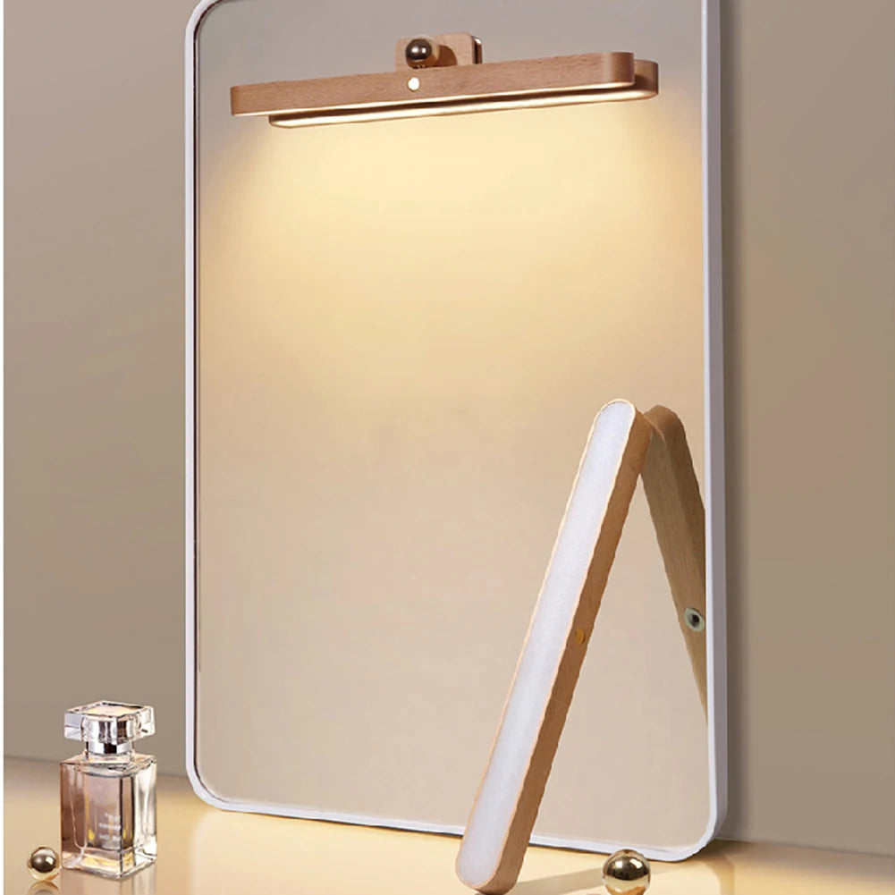 Illuminated wooden mirror light with warm LED glow, dimmable brightness for comfortable bedroom lighting